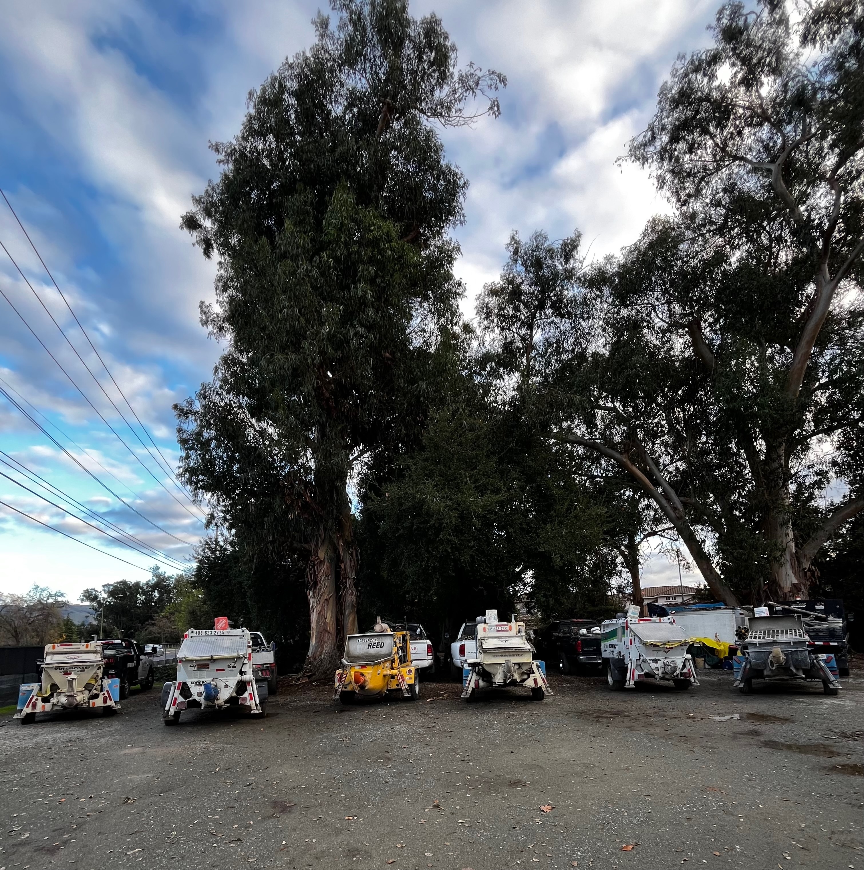 Fleet of concrete trailer pumps parked